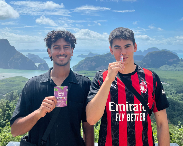 Two people with scenic background, one holding a product, 'Scenic Breath' text.