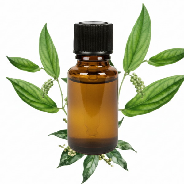Amber glass bottle with black cap surrounded by green leaves on a white background