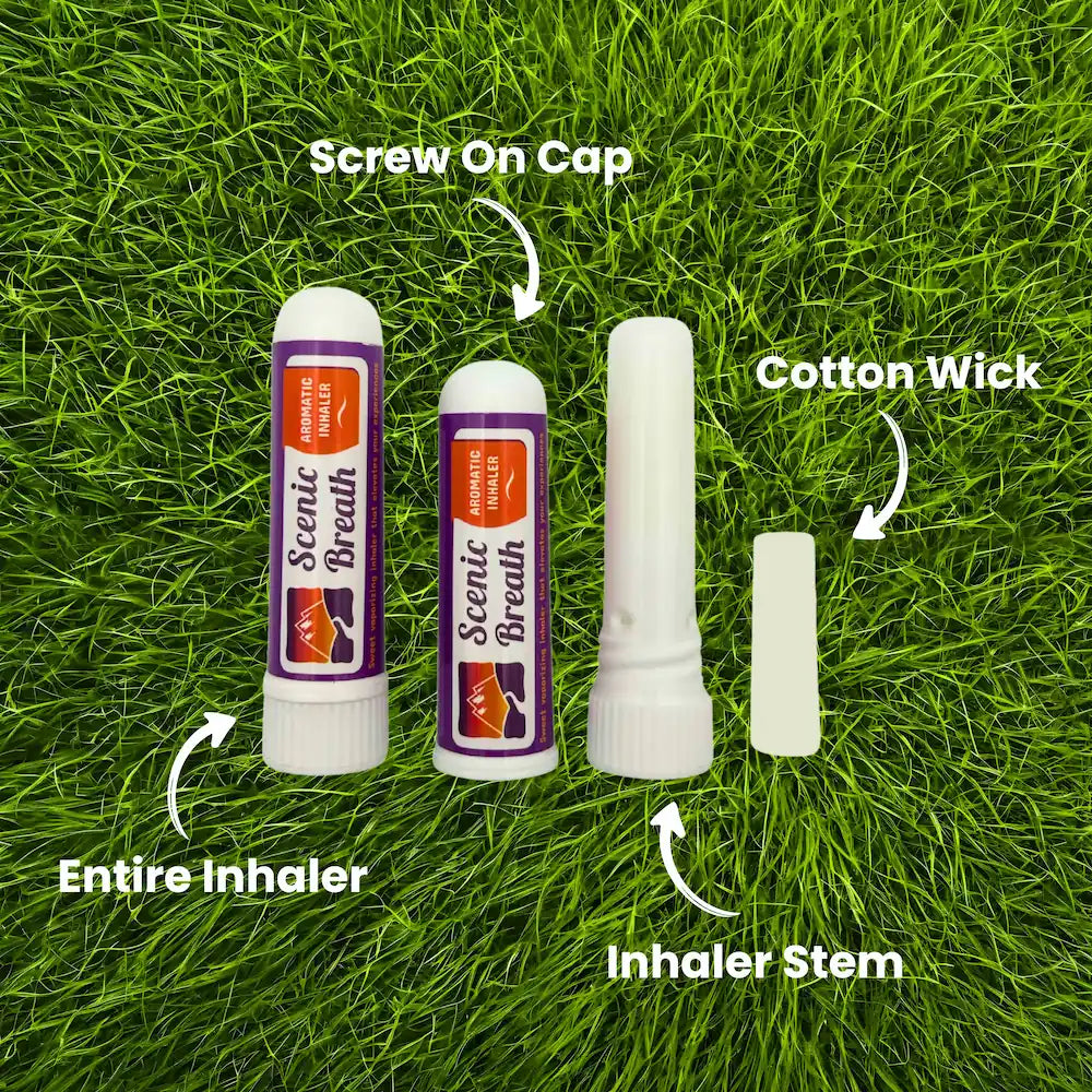 Scents of Breath inhaler components on grass with labels